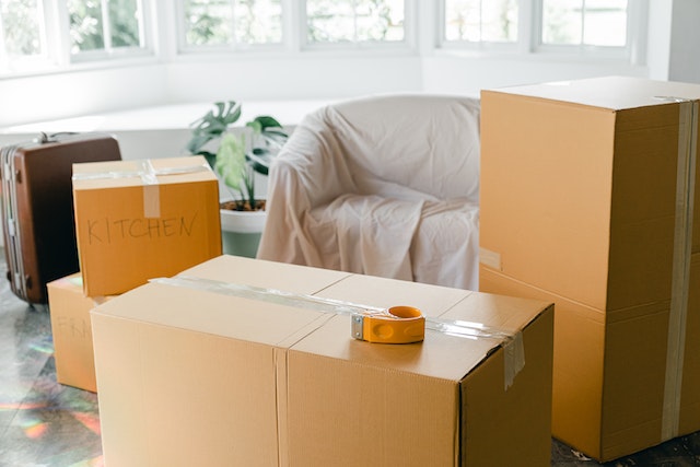 Living room at a Warrenton property full of brown moving boxes